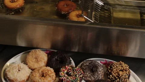 Donut making - deep frying Video stock 114667785