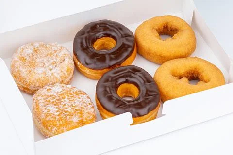 Donut or Doughnut. Donuts or Doughnuts box with chocolate brown glazed Stock Photos