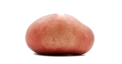 Donut peach isolated rotates on itself on white background. Stock Footage 113345035