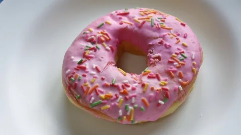 Donut in plate on background Stock Footage 76450866