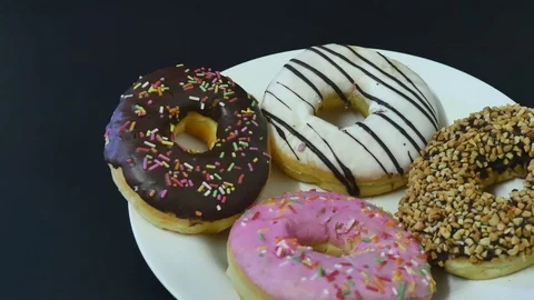 Donut in plate on background Stock Footage 76451142