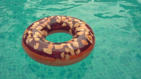 Donut rubber ring in swimming pool. Stock Footage 97041569
