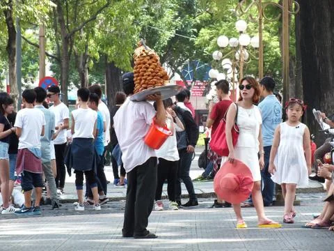 Donut seller on the steet of Saigon Stock Photos