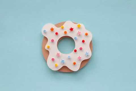 A donut sitting on top of a table Stock Photos