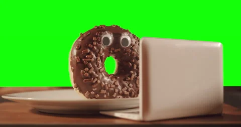 Donut using laptop. Watching content about the harmful of sugar. Green screen 스톡 동영상 237342793