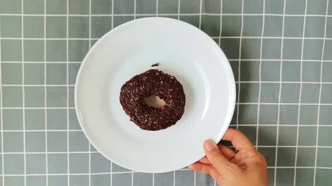 Donut on a white plate Stock Footage 288995186