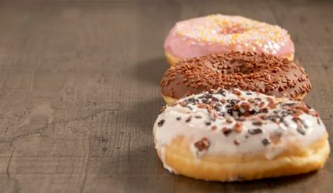 Donuts are on the table in different colors Stock Photos