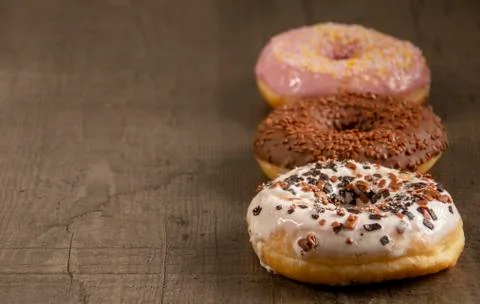Donuts are on the table in different colors Stock Photos