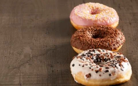 Donuts are on the table in different colors Stock Photos