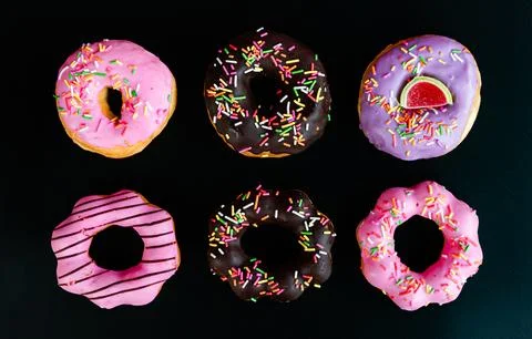Donuts, black background, quantity 6 pieces Stock Photos