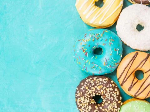 Donuts on blue background , copy space, top view Stock-Fotos