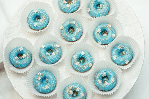 Donuts with blue glaze Stock Photos