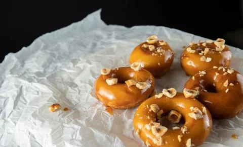 Donuts with caramel and nuts Stock Photos