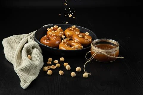 Donuts with caramel and nuts Stock Photos