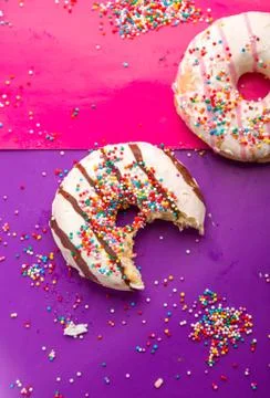 Donuts on color background. Stock Photos