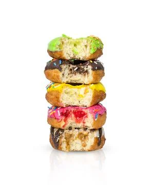 Donuts with different fillings in a stack and with bitten off pieces Stock Photos