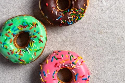 Donuts of different flavors for breakfast. Stock Photos