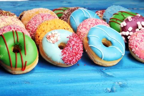 Donuts in different glazes with sprinkles Stock Photos