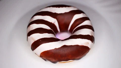 Donuts donut doughnut doughnuts closeup texture video on rolling rotating Stock Footage 104333841