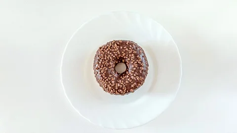Donuts, doughnuts appearing on white, stop motion animation Stock Footage 124840163