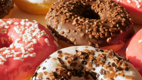 Donuts, doughnuts rotating, turning round, close 動画素材 124840235