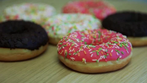 Donuts filled with icing lie on the table. Close-up. Stock Footage 90301795