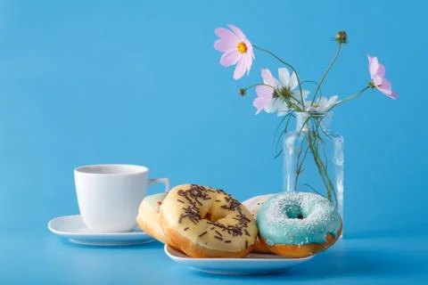 Donuts with flowers Stock Photos