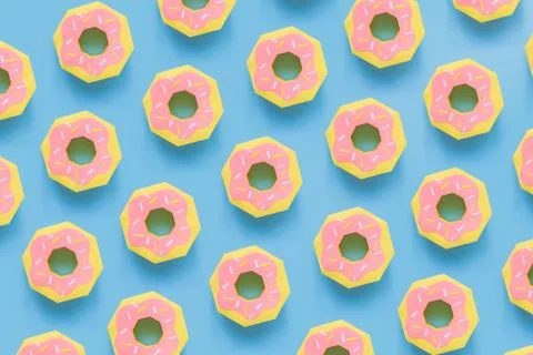 Donuts made of paper pattern on blue pastel background. Stock Photos