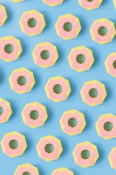 Donuts made of paper pattern on blue pastel background. Stock Photos