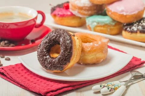 Donuts on a plate and coffee Stock Photos