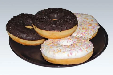 Donuts on a plate. Stock Photos