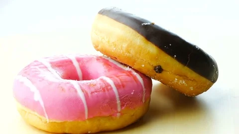 Donuts on rotating board Stock Footage 81187285