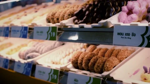 Donuts in the shop. Donuts showcase Stock Footage 58904143