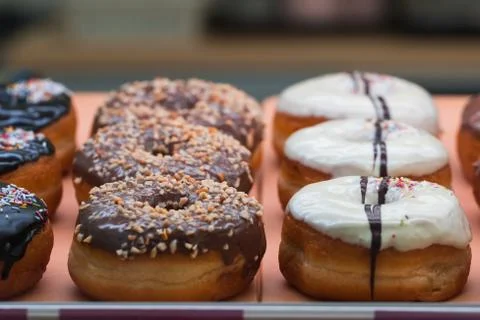 Donuts in the shop window. Stock Photos