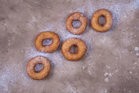 Donuts sprinkled with icing sugar Stock Photos