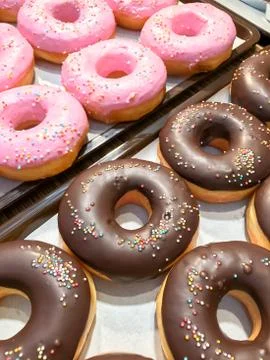 Donuts with sprinkles Stock Photos