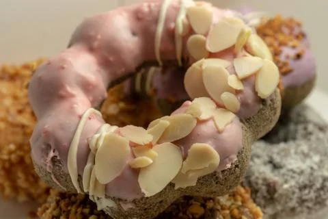 Donuts sweet strawberry cream with almonds Stock Photos