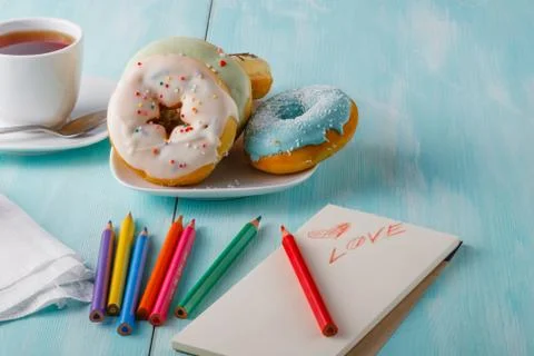 Donuts on table with sketchbook Stock-Fotos
