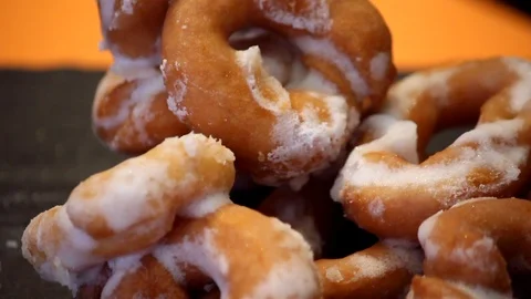 Donuts tipycal dessert. Slow Pan close-up. Focus on foreground Stock Footage 98017882