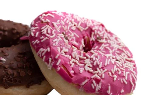 Donuts on a white background, two multi-colored donuts. Stock Photos