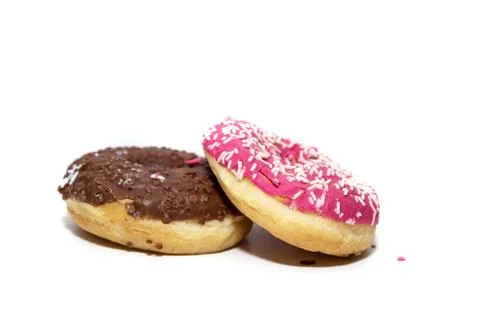 Donuts on a white background, two multi-colored donuts. Stock Photos
