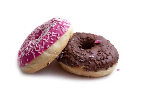 Donuts on a white background, two multi-colored donuts. Stock Photos