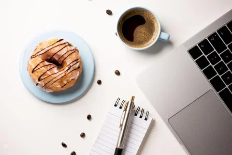 Donuts on working desk Stock Photos