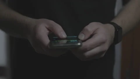 Doom scrolling. Hands of bored man scrolls social media or browsing internet Stock Footage 234146320