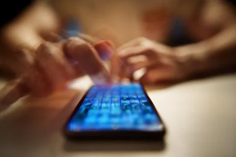 Doomscrolling. Close-Up of Man Scrolling Social Media Images on Smartphone. Stock Photos