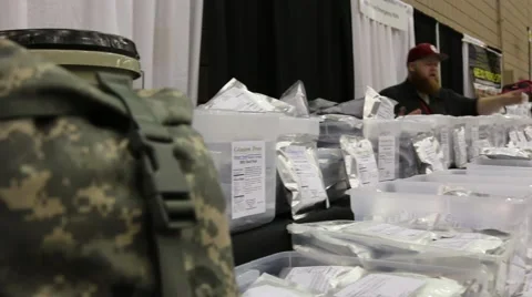 Doomsday Prepping Exhibitor Talks with Potential Customer  Stock Footage 64907536