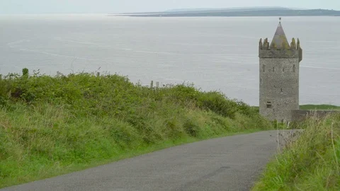 The Doonagore Castle in the coutnry of Ireland in Ireland Stock Footage
