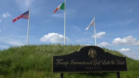 DOONBEG- 8.27.2023 -The American and Irish flags fly over the Trump Stock Footage 254115199