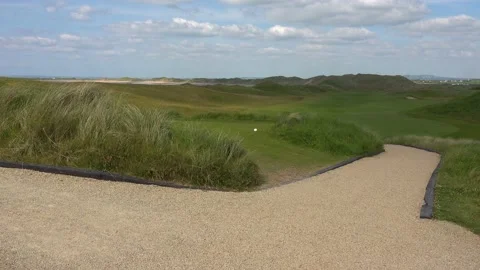 DOONBEG- 8.27.2023 -Clouds move over the golf green and pathway of the Trump Stock Footage 254114638