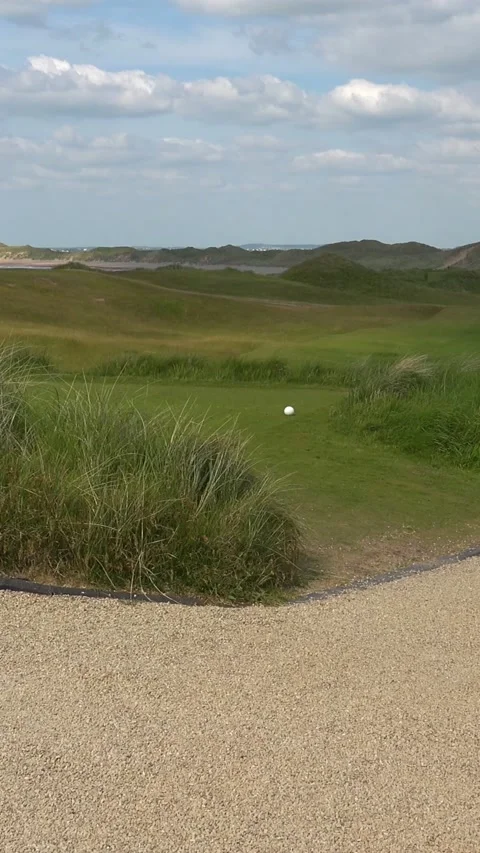 DOONBEG- 8.27.2023 -Clouds move over the golf green and pathway of the Trump Stock Footage 303986281